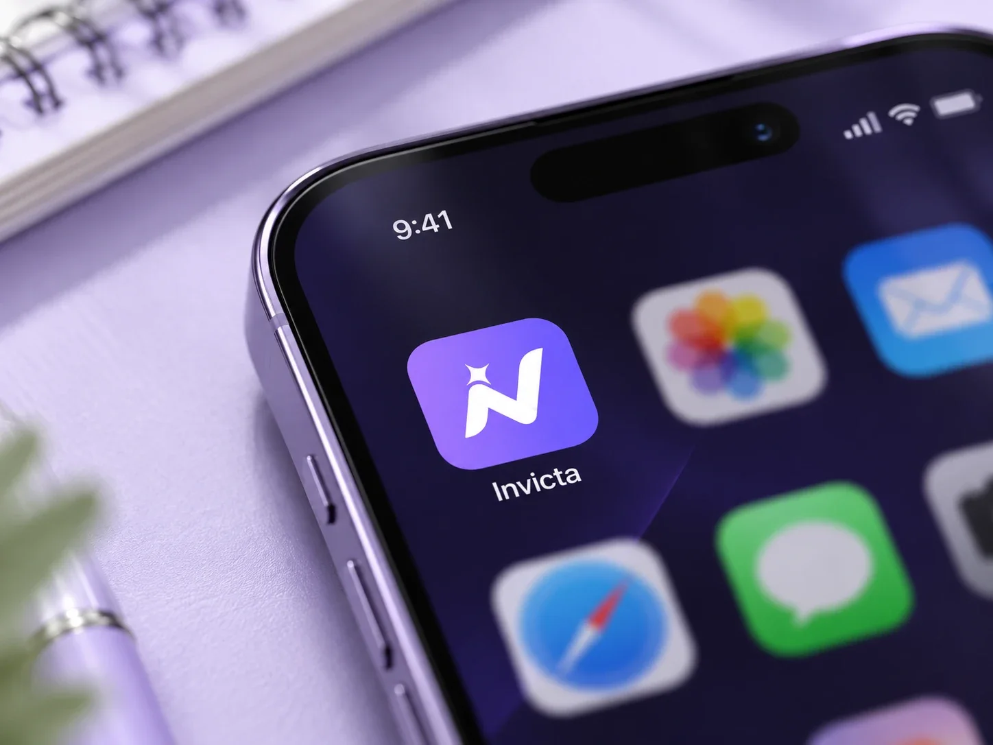 The Invicta app icon on a phone