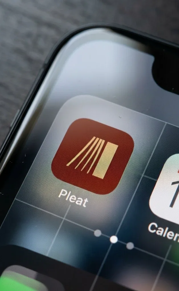 The Pleat app icon on a phone home screen