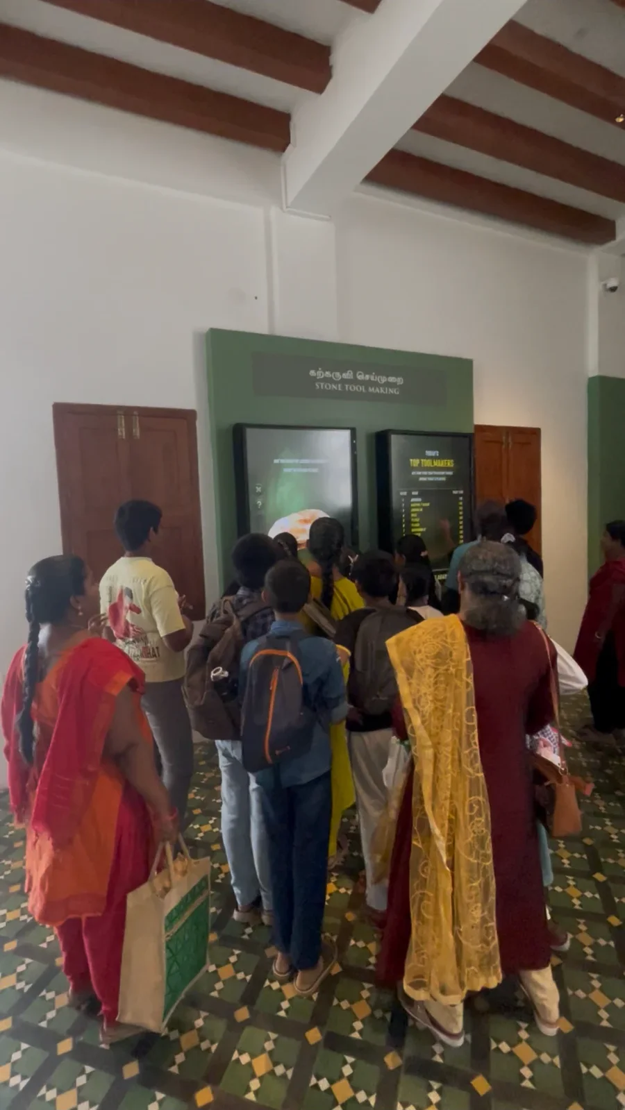 A crowd at the Stone Tool Making wall